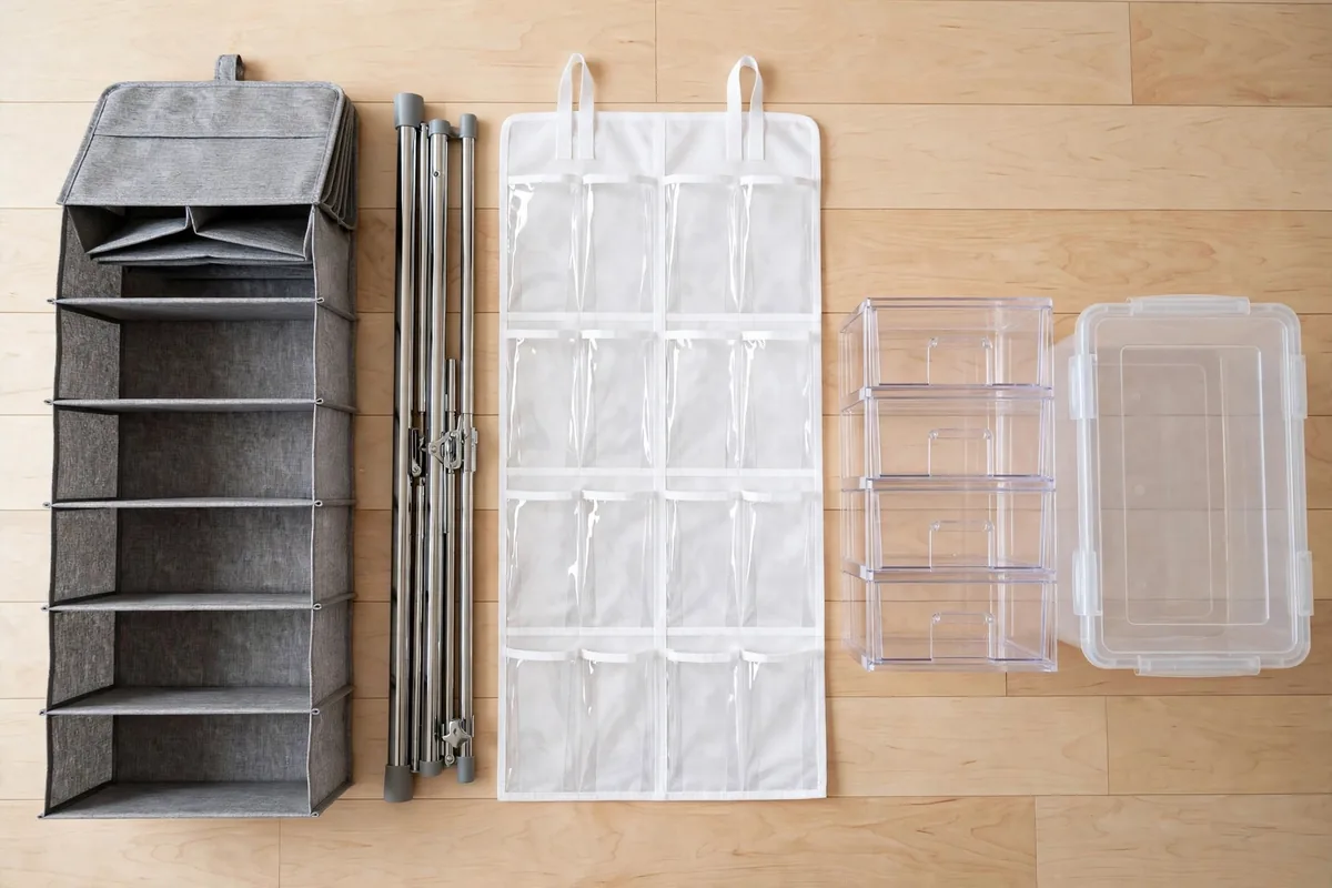 Flat lay of closet organizer types: hanging column, expandable rod, over-door organizer, stackable drawer, and lidded bin.