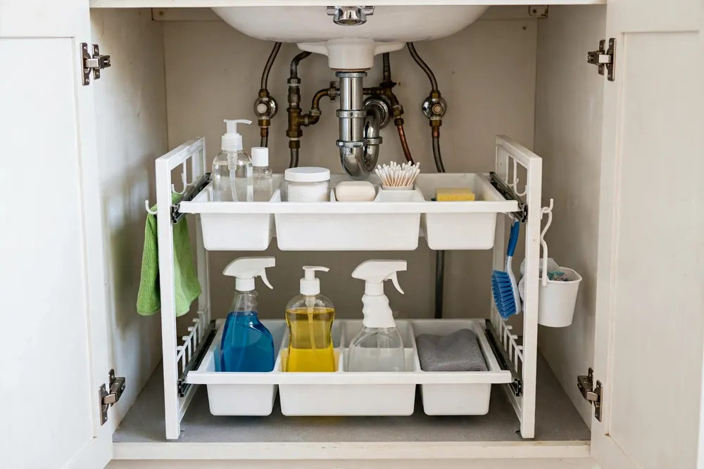 SPACEKEEPER white two-tier slide-out under sink organizer with dividers under a bathroom sink